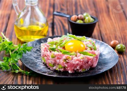 minced meat with spice and raw yolk