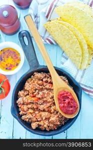 minced meat with tomato sauce in the pan