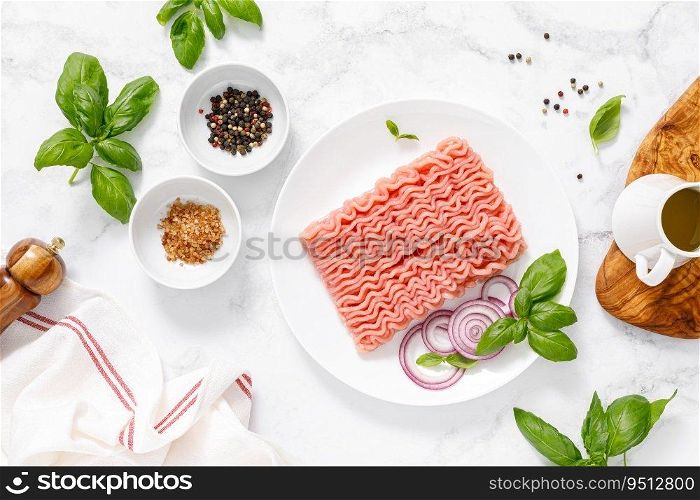 Mincemeat, forcemeat. Minced meat with ingredients for cooking, top view