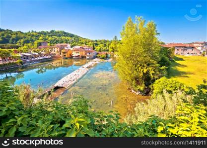 Mincio river green landscape and idyllic village of Borghetto view, Veneto region of northern Italy