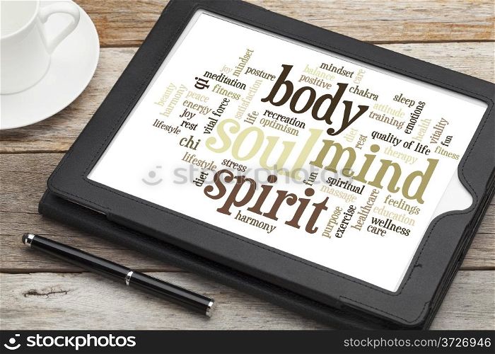 mind, body, spirit and soul - word cloud on a digital tablet