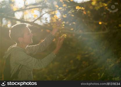 Mindful middle-aged woman appreciating the nature. Appreciating the nature