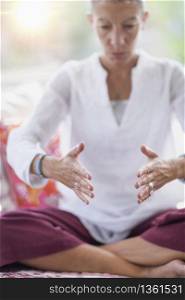 Mindful woman meditating, improving mental focus. . Improving Mental Focus Meditation Hand Gesture