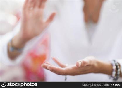 Mindful woman performing respect gesture with her hands. Spiritual awakening.. Respect