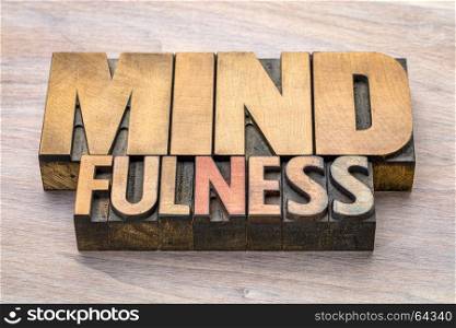 mindfulness word abstract or banner - awareness concept - text in vintage letterpress wood type printing blocks stained by color inks