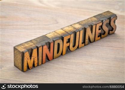mindfulness word abstract or banner - awareness concept - text in vintage letterpress wood type printing blocks against grained wood