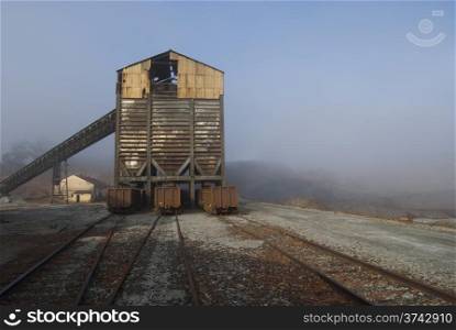 mineral carrier. mineral loading conveyor and freight cars