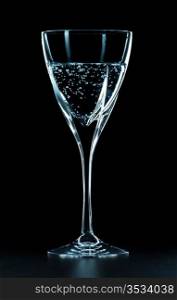mineral water glass isolated on black background