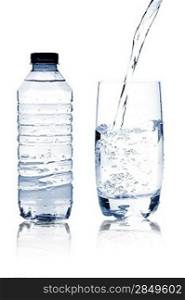 Mineral water in glass and bottle