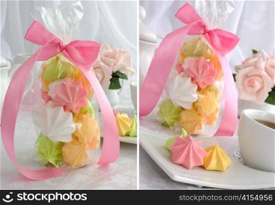 " Mini cakes "meringue" of different colors on a saucer with a cup of coffee and packaging"