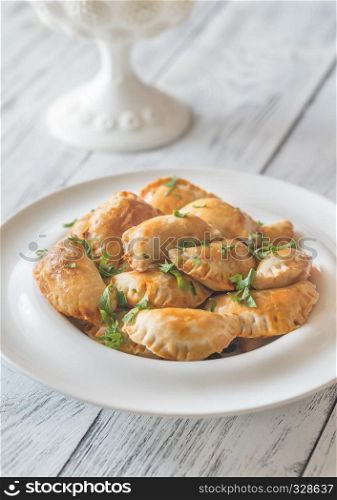 Mini chicken pies on the white plate