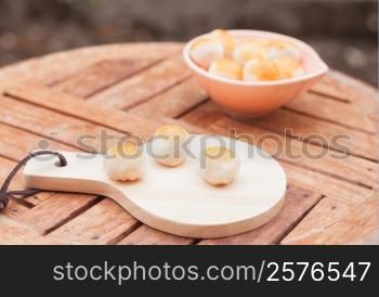 Mini Chinese cakes on wooden plate, stock photo