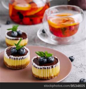 Mini chocolate cheesecake decorated with blueberries