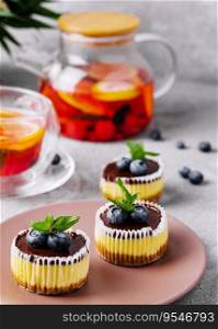 Mini chocolate cheesecake decorated with blueberries