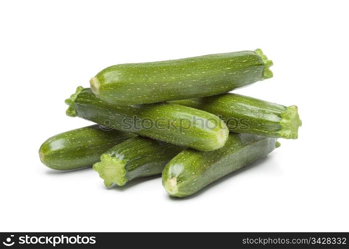 Mini courgettes on white background