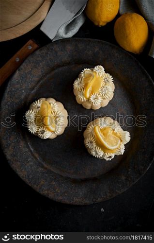 mini lemon bundt cakes topped with lemon. lemon bundt cakes