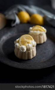 mini lemon bundt cakes topped with lemon. lemon bundt cakes