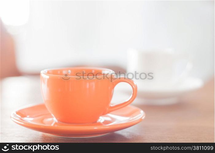 Mini orange coffee cup and white coffee cup, stock photo