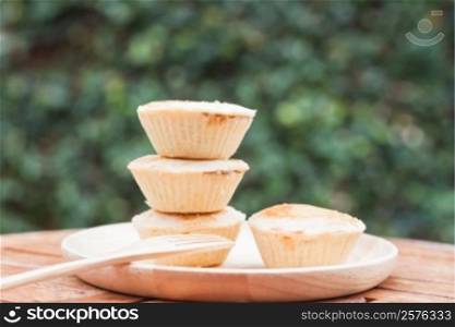 Mini pies on wooden plate, stock photo
