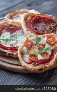 Mini pizzas on the wooden board