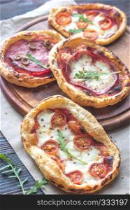 Mini pizzas on the wooden board
