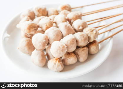 Mini pork balls in white plate on clean table