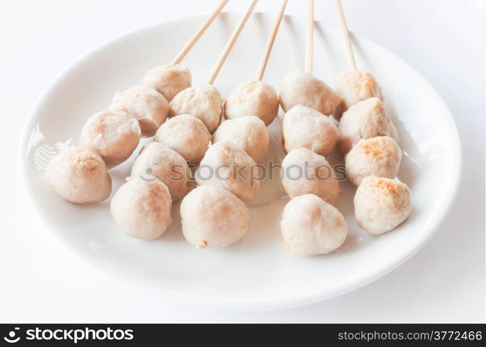 Mini pork balls in white plate on clean table