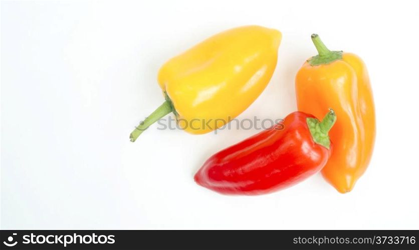 Mini Sweet Multi Color Peppers Sit on White Background