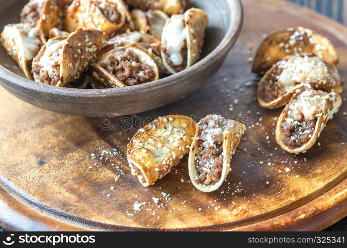 Mini tacos with ground beef, mozzarella and parmesan