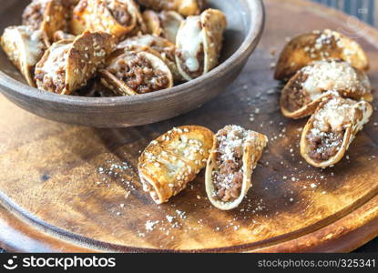 Mini tacos with ground beef, mozzarella and parmesan