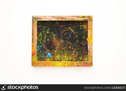 miniature blackboard with different colored powder isolated white background