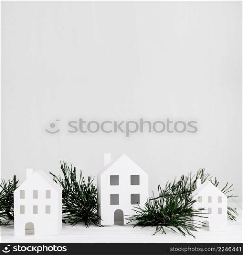 miniature houses with fir branch