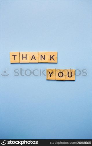 Miniature inscription in wooden letters, thank you wooden wording. Thank you concept, banner, postcard, background. Place for an inscription. Miniature inscription in wooden letters, thank you wooden wording. Thank you concept, banner, postcard, background. Place for an inscription.