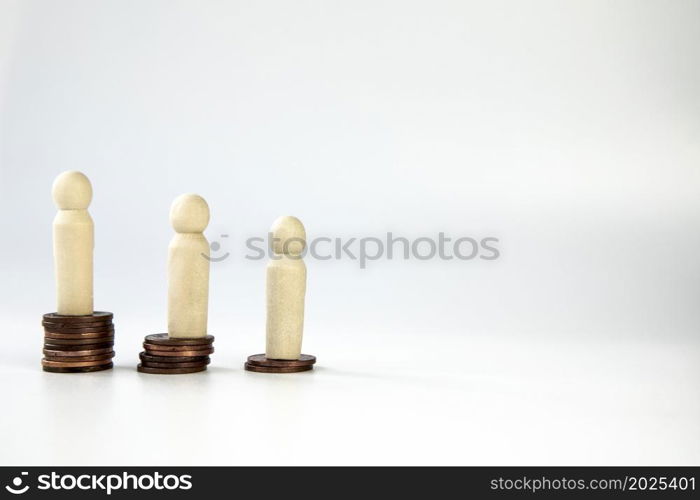 Miniature people standing on piles of different heights of coins. The concepts of person and wealth. business and financial concept isolated on white background with copy space. One person poor and the other rich space for text. Miniature people standing on piles of different heights of coins. The concepts of person and wealth. business and financial concept isolated on white background with copy space. One person poor and the other rich