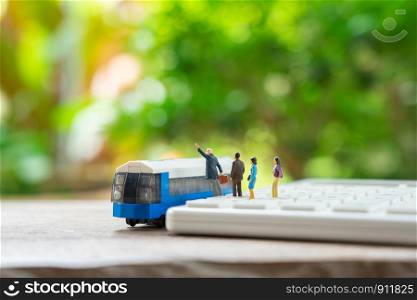 Miniature people standing travel planner with toy car model as background travel concept with copy space.