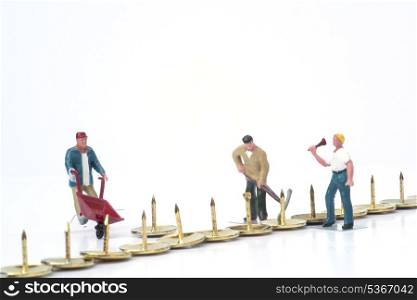 Miniature people teamwork overcoming obstacles business concept