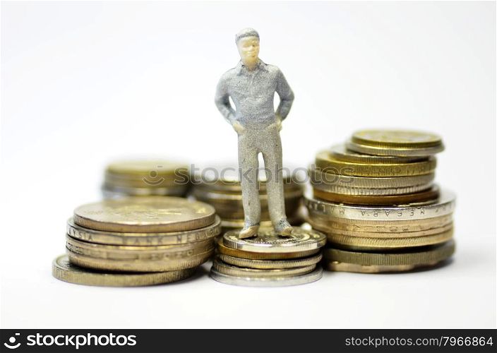 Miniature people with coins. Business and finance concept