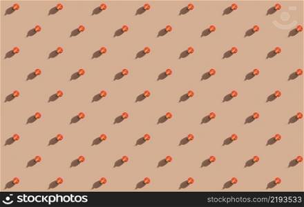 Minimal creative pattern of halves of red cherry tomatoes. Minimal food concept on orange background. Seamless pattern for poster or advertisement