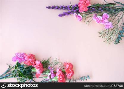 Minimal flat lay Frame with fresh flowers, copy space in middle, idea for banner advertisement