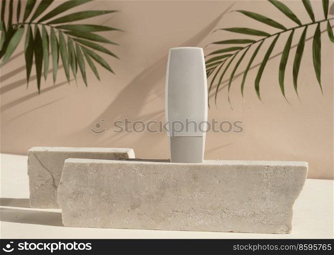 Minimal modern cosmetic products display with one tube on beige background with shadow overlay, toned. Minimal product display