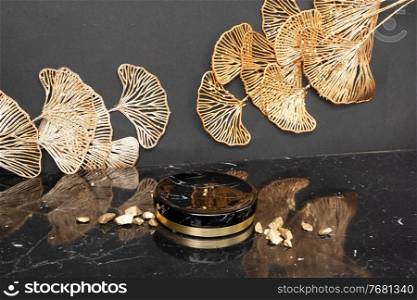 Minimal modern product display on black and golden abstract flowers on background with podium, luxury 20s art deco style. black and gold product display