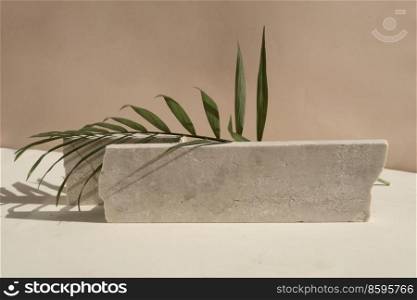 Minimal modern product display on neutral beige background with podium with palm leaves, toned. Minimal product display
