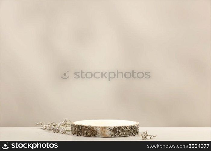 Minimal modern product display on neutral beige background. Wood slice podium and dry flowers. Concept scene stage showcase for new product, promotion sale, banner, presentation, cosmetic