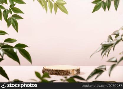 Minimal modern product display on pastel pink background. Wood slice podium and green leaves. Concept scene stage showcase for new product, promotion sale, banner, presentation, cosmetic