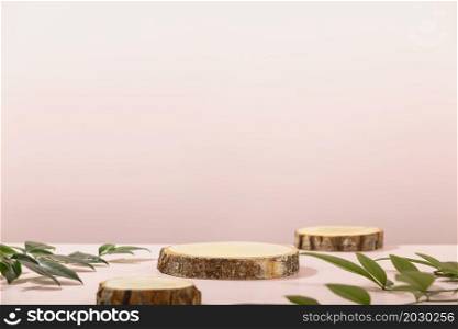 Minimal modern product display on pink background. Wood slice podiums and green leaves. Concept scene stage showcase for new product, promotion sale, banner, presentation, cosmetic