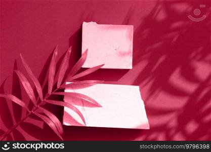 Minimal modern product display on viva magenta background with palm leaves and shadow overlay, top view with copy space. Minimal product display