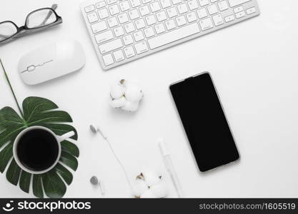 Minimal Office desk table top view with Keyboard computer, mouse, white pen, cotton flowers, Glasses, white fabric on a white table with copy space, White color workplace composition, flat lay