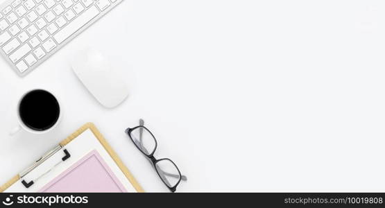 Minimal Office desk table top view with office supply and coffee cup on a white table with copy space, White color workplace composition, flat lay