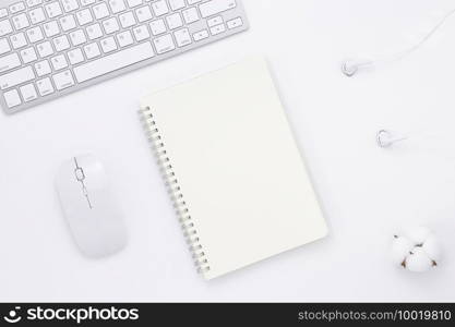 Minimal Office desk table top view with office supply and coffee cup on a white table with copy space, White color workplace composition, flat lay