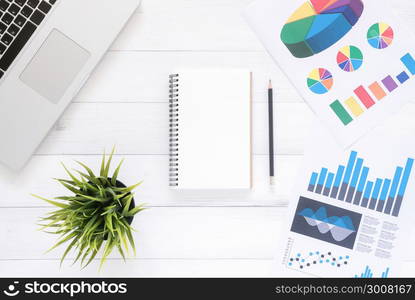 Minimal work space - Creative flat lay photo of workspace desk. Top view office desk with laptop, mock up notebooks and plant on white wooden background. Top view with copy space, flat lay photography